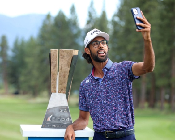 Ashkay Bhatia taking selfie with Trophy