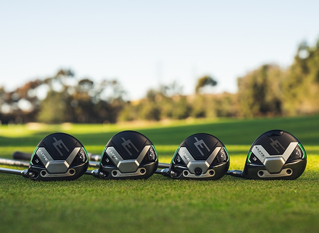 Johnny Wunder Standing In Front of Elyte Fairway Wood Club Heads